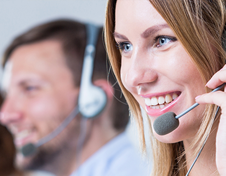 young woman in customer service call center talking to a customer